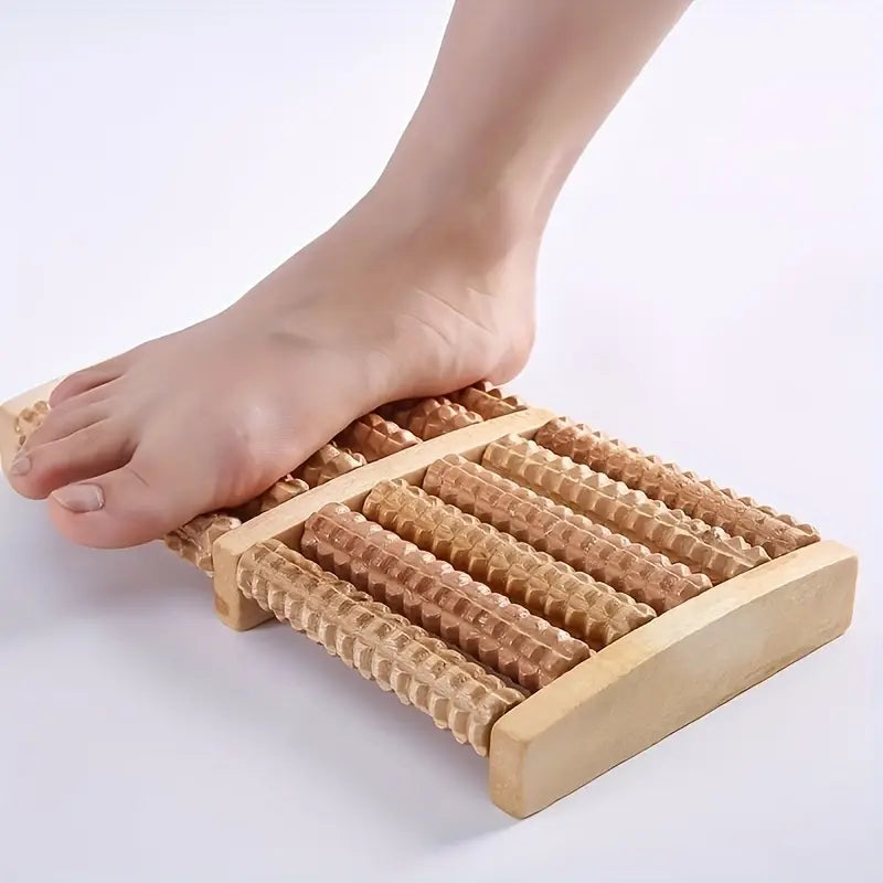 Foot using the Sole Relief wooden roller