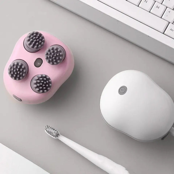 Electric scalp massager shown on a bathroom counter