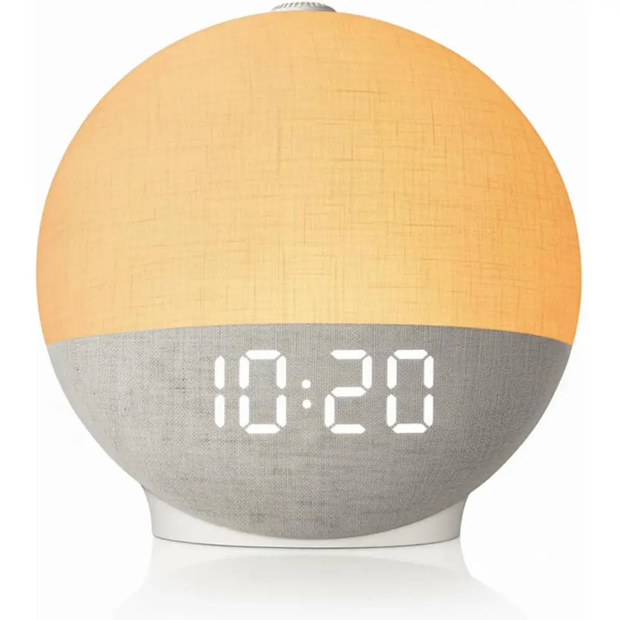 First Light sunrise wake-up lamp on a nightstand